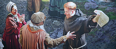 Streitbar: Diskussion um Luthers Thesen 1517, dargestellt vom Künstler Yadegar Asisi im Luther-Panorama in Wittenberg. (Foto: medio.tv/Dellit)