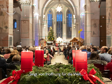 Auf dem Adventskalender der Ausbildungshilfe ist die Stiftskirche in Kaufungen im Advent abgebildet.